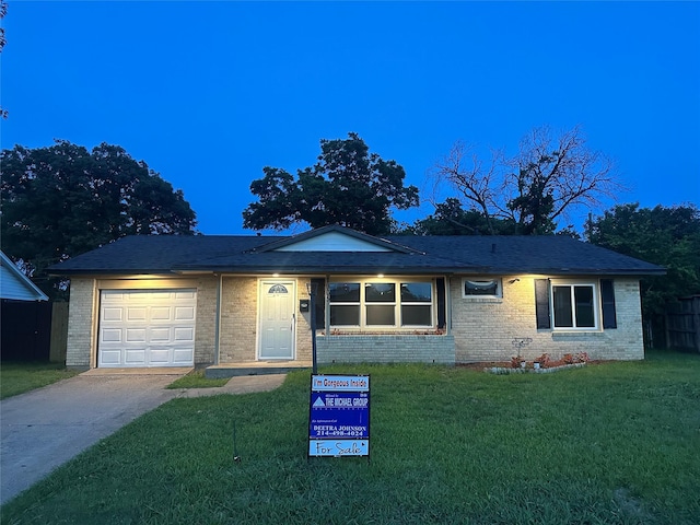 1905 Virginia Dr, Grand Prairie, TX 75051 - ranch-style home with a garage, driveway, brick siding, and a front lawn