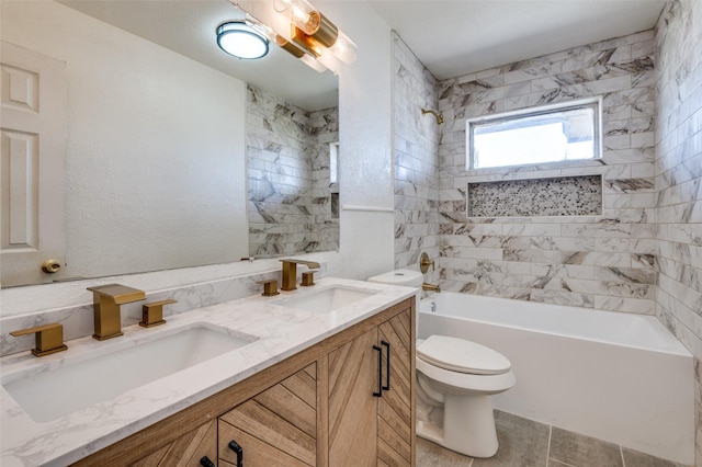 full bathroom with vanity, tiled shower / bath combo, tile patterned floors, and toilet