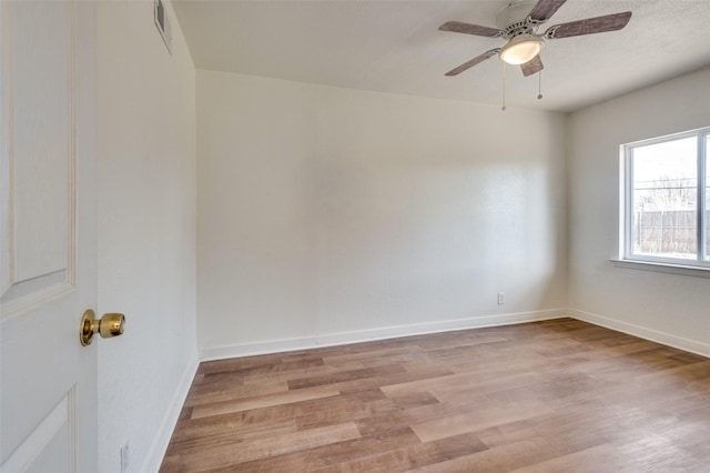 unfurnished room with ceiling fan and light hardwood / wood-style floors