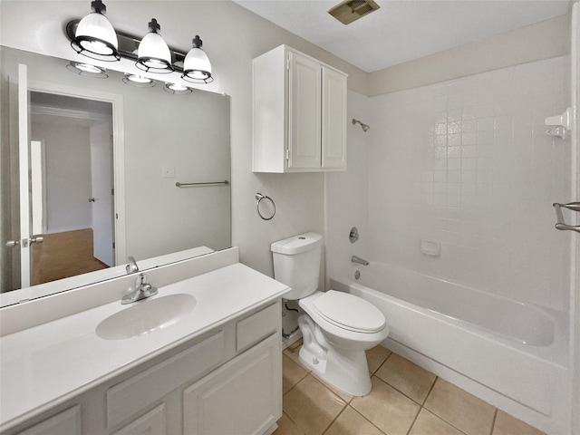 full bathroom featuring washtub / shower combination, tile patterned floors, toilet, and vanity