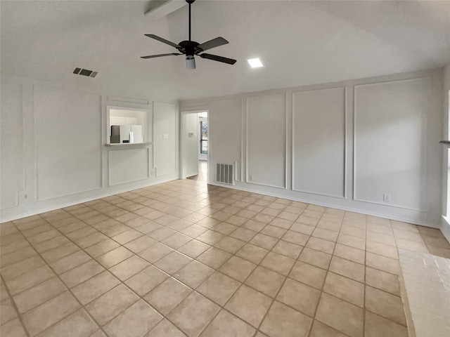 unfurnished room with light tile patterned floors, lofted ceiling with beams, and ceiling fan