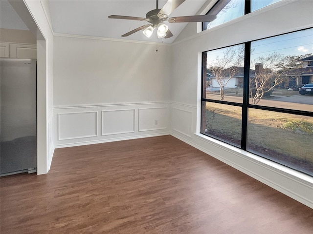 unfurnished room featuring dark wood-type flooring, ceiling fan, lofted ceiling, and a wealth of natural light