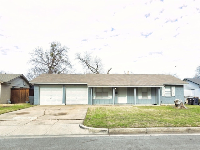 single story home with a garage and a front lawn