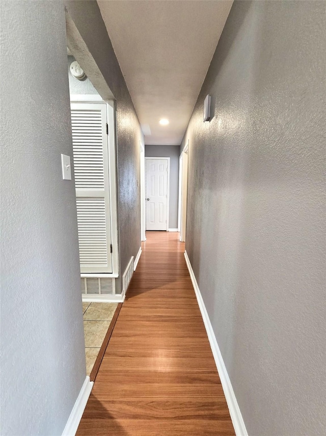 hall featuring wood-type flooring