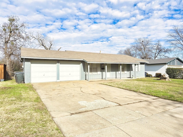 single story home with a garage and a front lawn