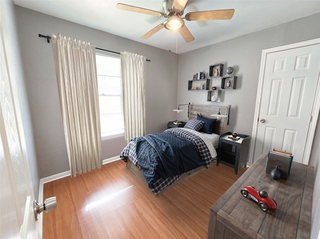 bedroom featuring wood-type flooring and ceiling fan