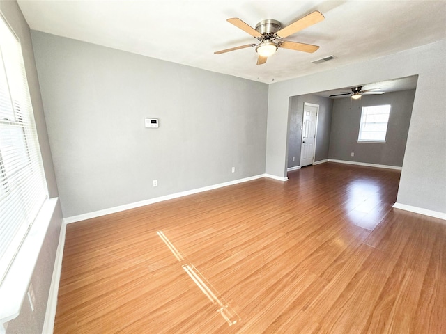 unfurnished room with wood-type flooring and ceiling fan