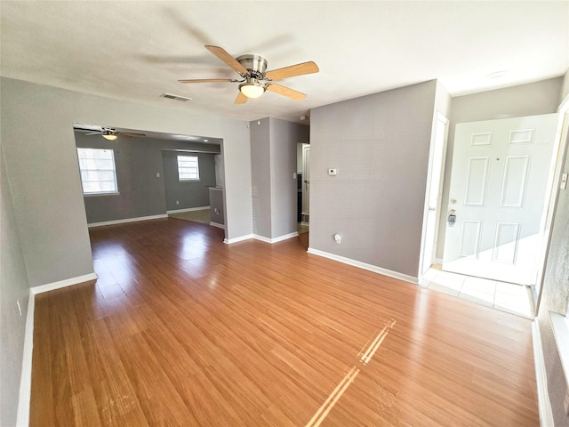 unfurnished living room featuring hardwood / wood-style flooring