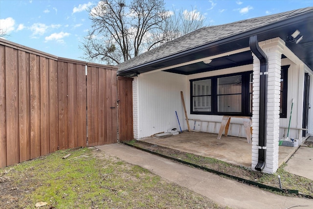 exterior space with a shingled roof