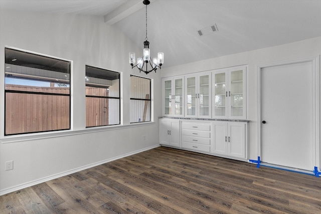 unfurnished dining area with lofted ceiling with beams, dark wood finished floors, visible vents, and a notable chandelier