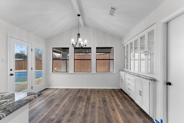 unfurnished dining area with a notable chandelier, dark wood-type flooring, and lofted ceiling with beams