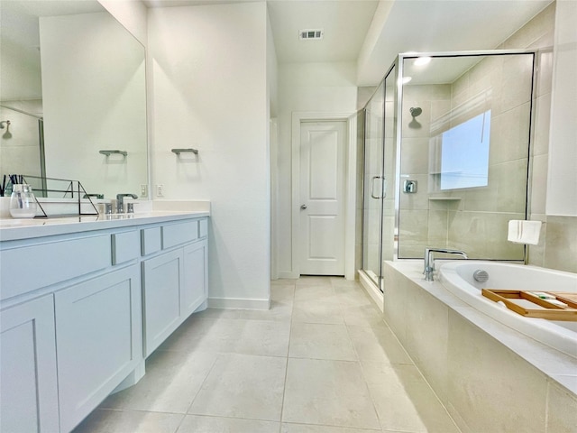 bathroom featuring vanity, visible vents, a stall shower, tile patterned flooring, and a garden tub