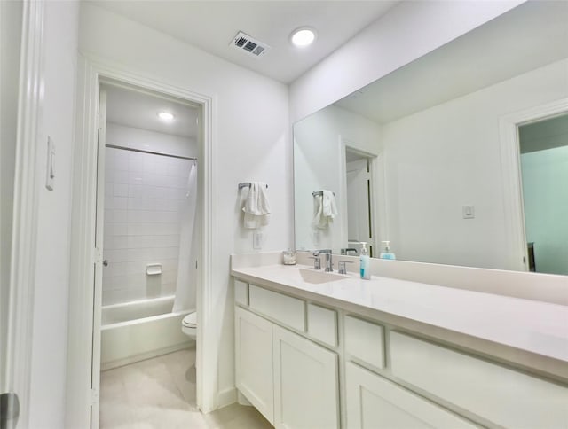 full bathroom with shower / tub combo with curtain, vanity, and toilet