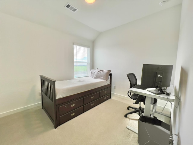 bedroom with lofted ceiling and light carpet