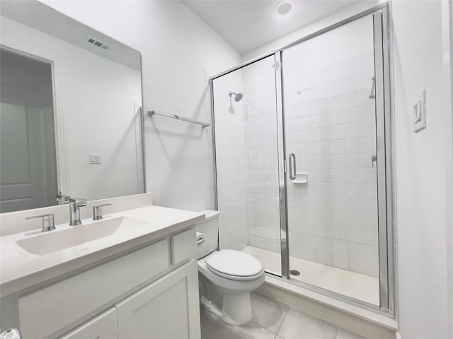 bathroom with walk in shower, vanity, toilet, and tile patterned flooring