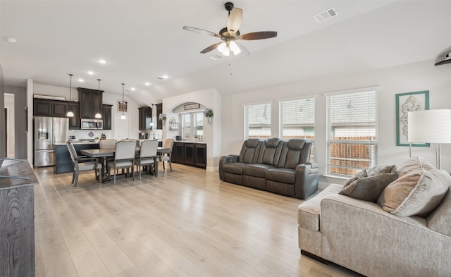 living area with lofted ceiling, recessed lighting, visible vents, light wood-style floors, and ceiling fan