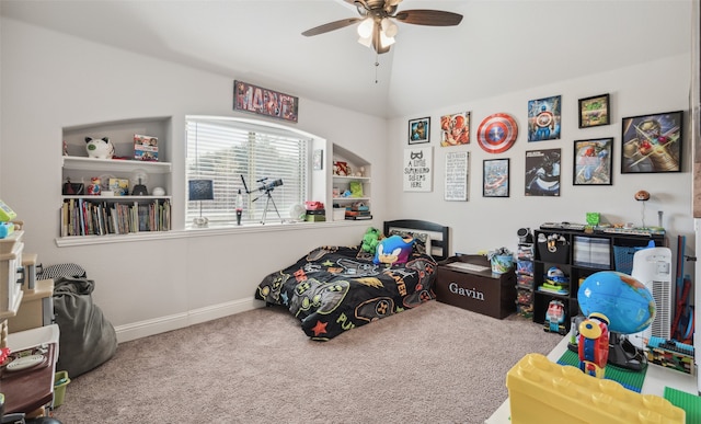 bedroom with carpet floors, baseboards, a ceiling fan, and lofted ceiling