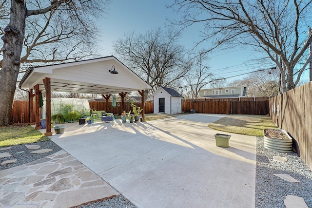 view of patio / terrace featuring a gazebo and a storage unit