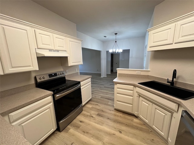 kitchen featuring stainless steel electric range oven, dishwasher, sink, light hardwood / wood-style floors, and an inviting chandelier