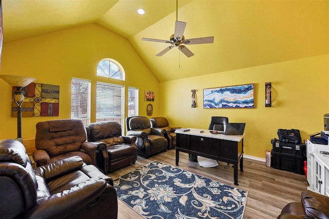 living room featuring vaulted ceiling, ceiling fan, and light hardwood / wood-style floors