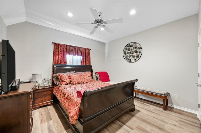 bedroom featuring ceiling fan, lofted ceiling, and light hardwood / wood-style flooring