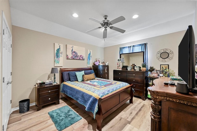 bedroom featuring light hardwood / wood-style flooring and ceiling fan