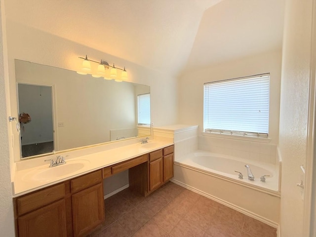 bathroom with tile patterned floors, vanity, and a bathtub