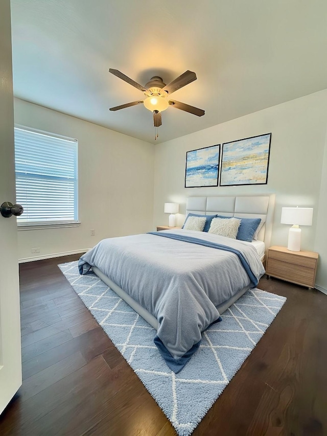 bedroom featuring dark wood-type flooring and ceiling fan