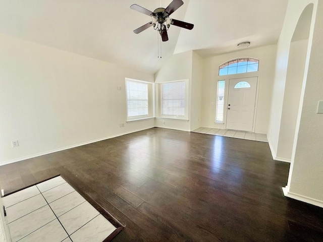 entryway with hardwood / wood-style flooring, vaulted ceiling, and ceiling fan