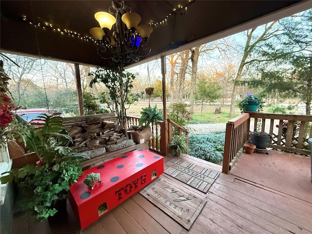 sunroom featuring an inviting chandelier