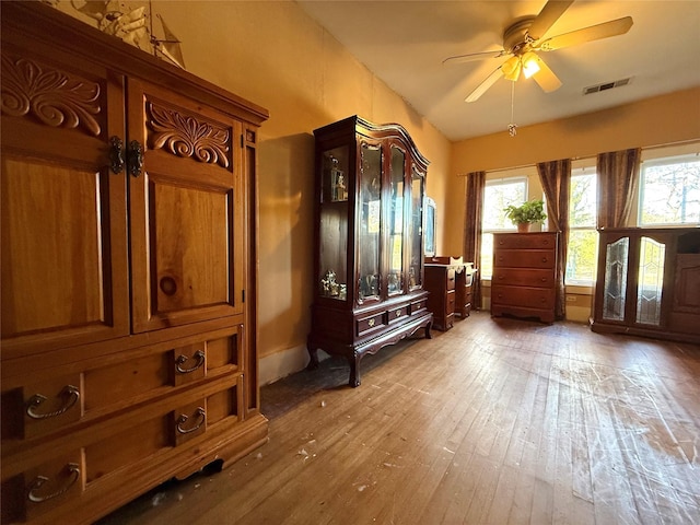 mudroom featuring ceiling fan, visible vents, and wood finished floors