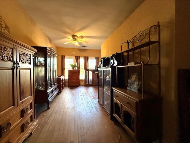 mudroom featuring a ceiling fan and wood finished floors