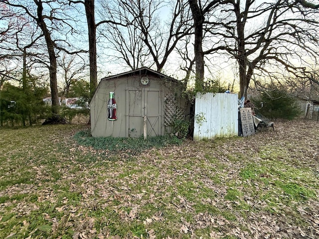 view of outdoor structure with a yard