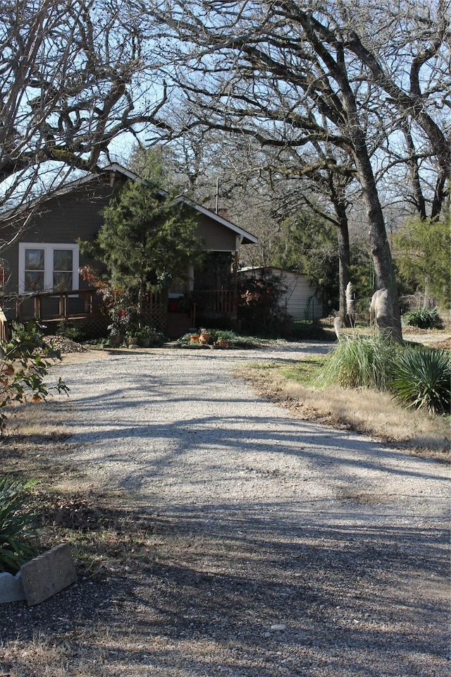 view of side of home with driveway