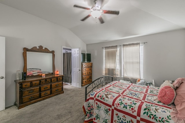 bedroom featuring light carpet, lofted ceiling, and ceiling fan