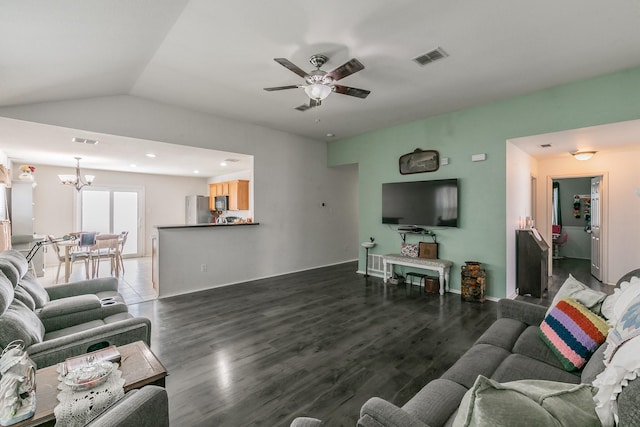 living room featuring dark wood-type flooring, vaulted ceiling, and ceiling fan with notable chandelier