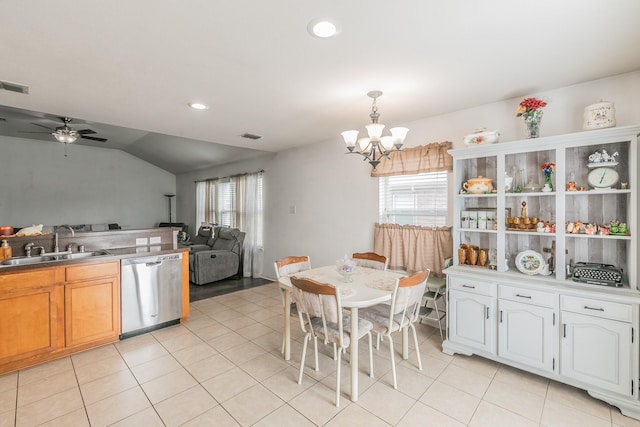 kitchen with pendant lighting, white cabinetry, sink, stainless steel dishwasher, and light tile patterned floors