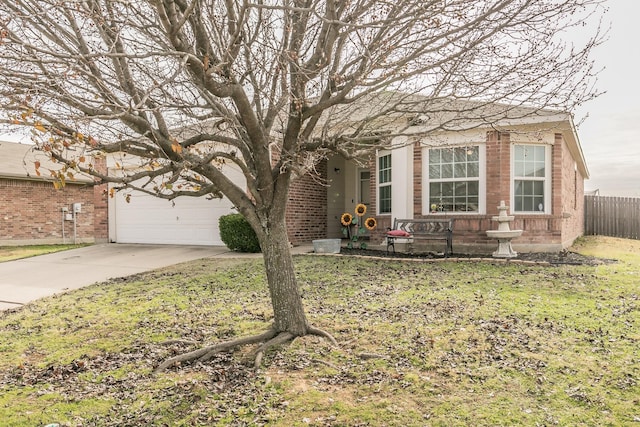 view of front of property featuring a garage and a front lawn