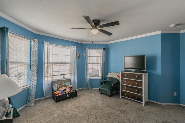 living area featuring crown molding, ceiling fan, and carpet floors