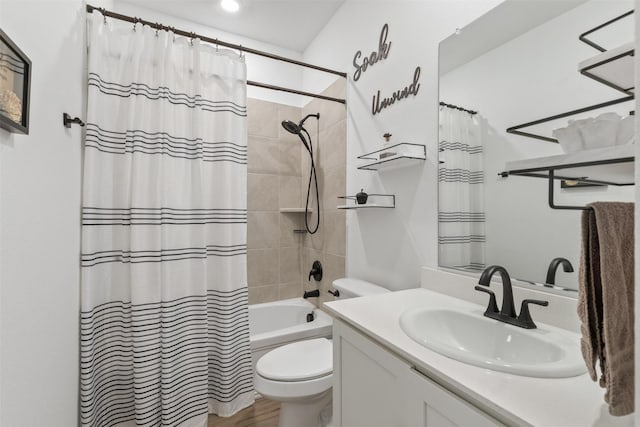 full bathroom featuring vanity, toilet, wood-type flooring, and shower / bath combo