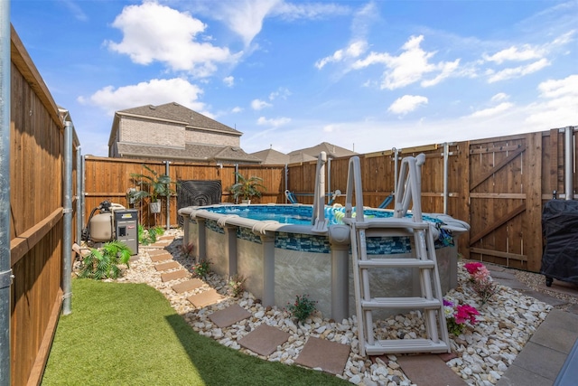 view of pool featuring a yard