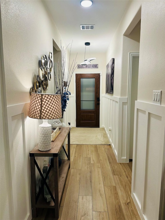 hallway featuring light hardwood / wood-style floors