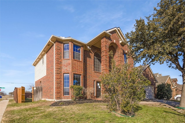 view of front of property with a garage and a front lawn