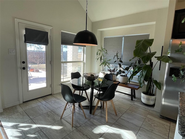 dining area with vaulted ceiling