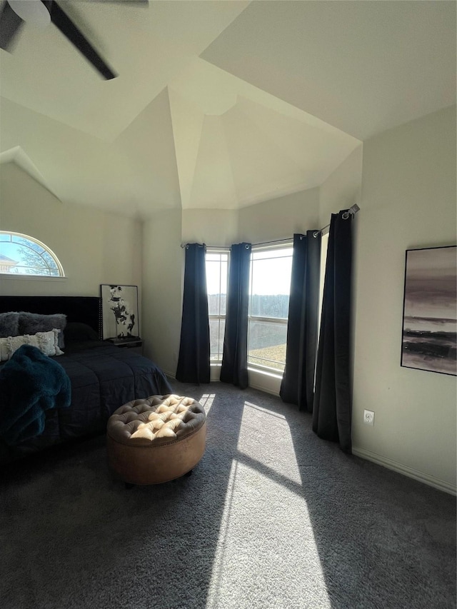 carpeted bedroom with vaulted ceiling and ceiling fan