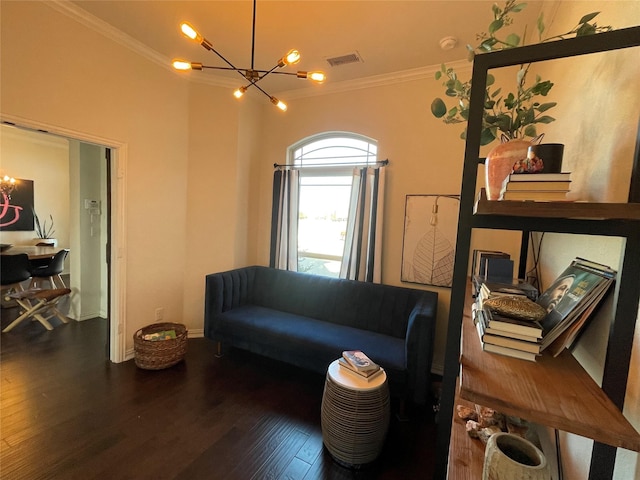 living room with hardwood / wood-style flooring, ornamental molding, and a chandelier