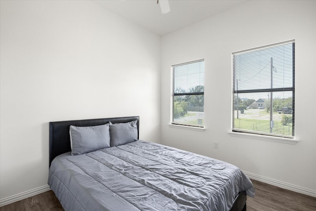 bedroom featuring dark wood-type flooring and ceiling fan