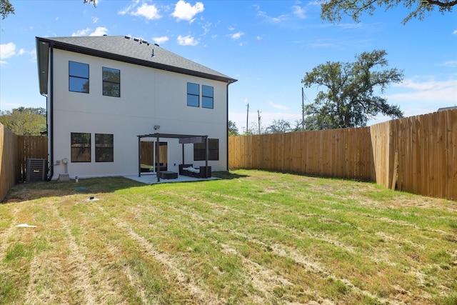 rear view of house with a patio area and a lawn