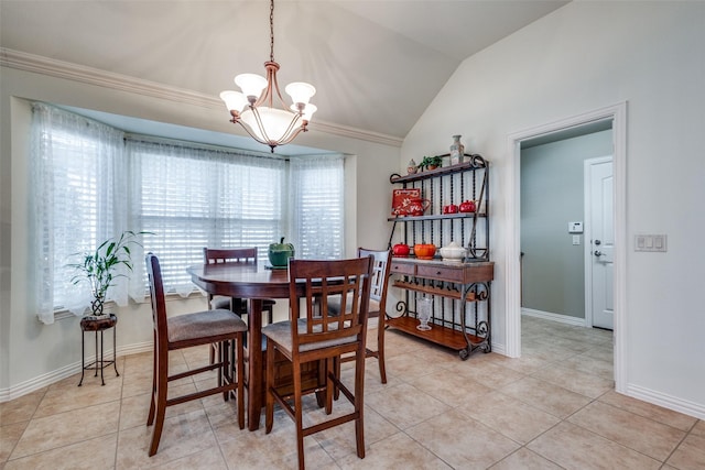 dining room with vaulted ceiling, light tile patterned floors, a notable chandelier, and crown molding