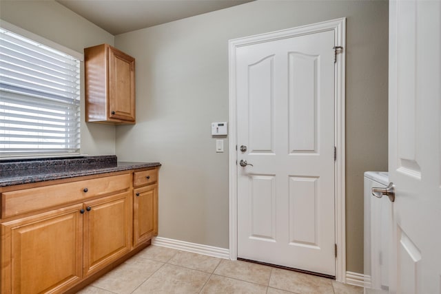 washroom with light tile patterned flooring